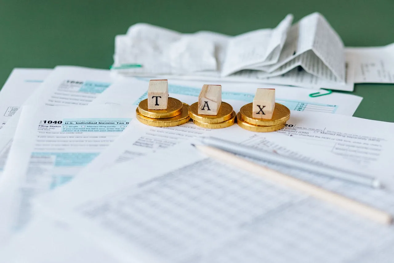 Tax documents and coins symbolizing tax benefits for foreign investors in Morocco